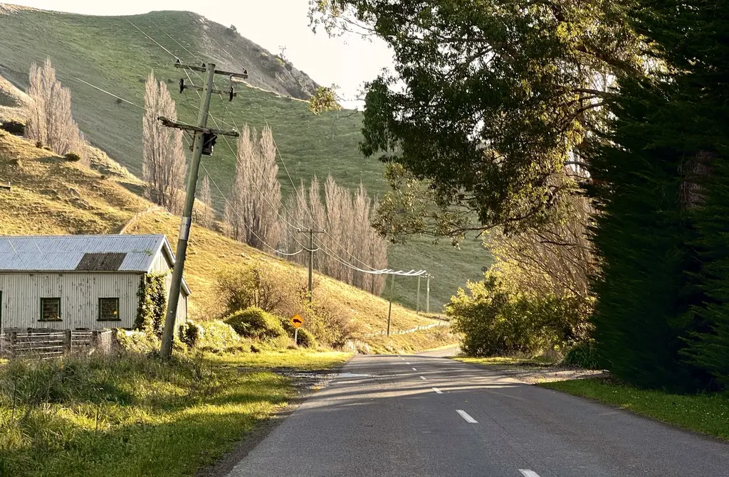 A country road winding through farmland